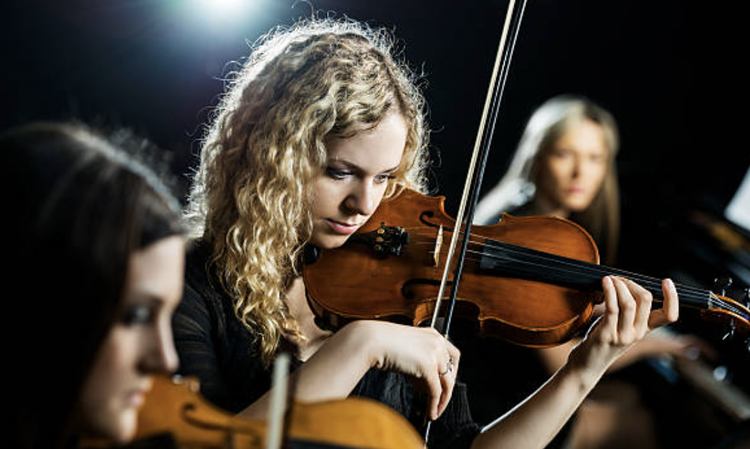 String musicians performing together for a formal wedding event